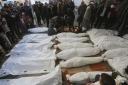 Palestinians mourn relatives killed in the Israeli bombardment on Rafah, Gaza Strip