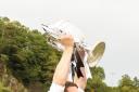 Lovat captain Daniel Grieve lifts the 2015 Camanachd Cup