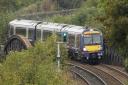 File photo dated 15/10/13 of a First Group train passing through Inverkeithing in Scotland, as FirstGroup has agreed a contract with the Department for Transport for its joint venture Transpennine Express rail franchise to run for a further year until 201