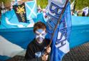 A young Scottish independence supporter at an All Under One Banner march in Glasgow