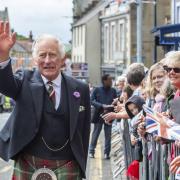 King Charles III during a tour of the market square in Selkirk