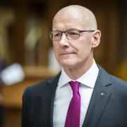John Swinney can take on questions around a Scottish currency