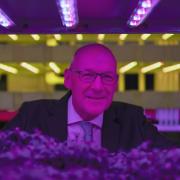 First Minister John Swinney takes a closer look at the innovative vertical farm growth towers at the Crop Research Centre, during a visit to Intelligent Growth Solutions in Dundee
