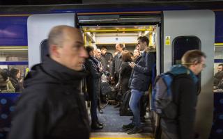 Commuters on a train into Glasgow Central.