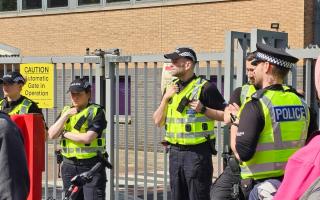 Police Scotland officers are stationed at the Glasgow immigration centre