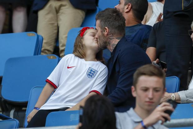 David Beckham kissed his daughter Harper on the lips as they were watching a match