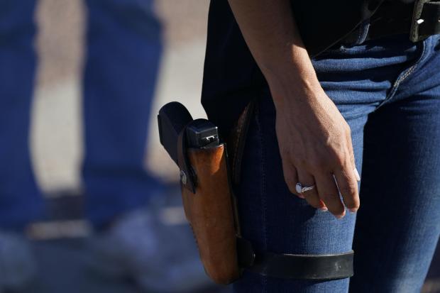 The National: Lauren Boebert, the Republican candidate, with a gun in her holster (David Zalubowski/AP)
