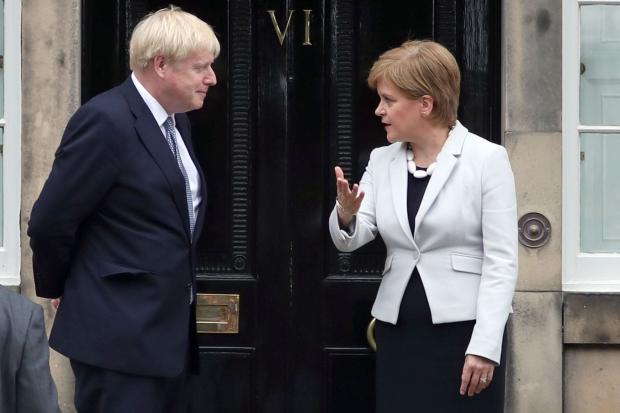 The National: Boris Johnson and Nicola Sturgeon