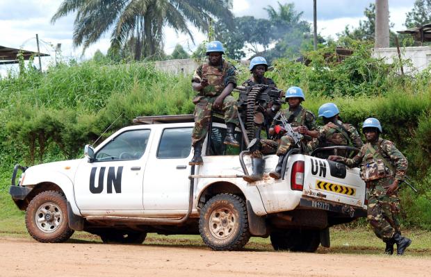 The National: Blue helmet members of the United Nations Organization Stabilization Mission in the Democratic Republic of Congo. Photo credit should read Alain Wandimoyi/AFP/Getty Images).