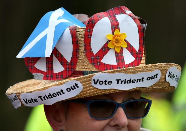The National: Anti-Trident demonstrators at the entrance at the  North Gate at HM Naval Base Clyde, Faslane. PRESS ASSOCIATION Photo. Picture date: Monday April 13, 2015. The Scrap Trident Coalition say they have blocked all entrances to the base, which is home to the