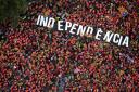 Independence supporters form the word 'independence' during Catalonia's National Day in Barcelona, 2018