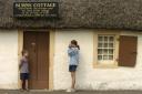 Tourists outside Burns Cottage in Alloway near Ayr