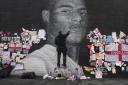 Messages of support were left at a mural of footballer Marcus Rashford after racist slogans were graffitied over it