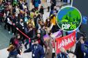 Climate activists stage mass walk out of COP26 as negotiations enter final hours