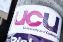 A University and College Union (UCU) arm band (Peter Byrne/PA)