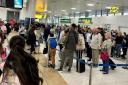 Queues are snaking through the airport this morning