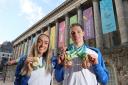 Scotland's Duncan Scott (right) and Eilish McColgan posing with their Commonwealth Games medals