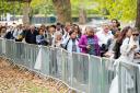 Members of the public at the end of the queue in Southwark Park in London