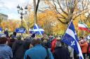The  Rassemblement pour un Pays Souverain held up Scottish flags at a commemoration of the Patriots War