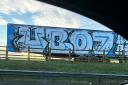 An Alba Party billboard beside the M80 has been covered up with Union Bears graffiti