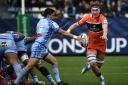 Castres' French scrum-half Gauthier Doubrere (L) kicks the ball as Edinburgh's Scottish flanker Jamie Ritchie (R) tries to intercept during the European Rugby Champions Cup pool A rugby union match between Castres Olympique and Edinburgh Rugby at the