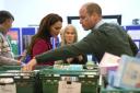 Kate and William helped pack food supplies and check labels on a visit to a Windsor food bank