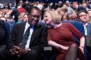 Liz Truss whispers in the ear of former chancellor Kwasi Kwarteng during the Tory conference last year