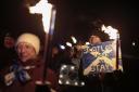 Anti-Brexit campaigners take part in a torchlight procession to the Scottish Parliament on the third anniversary of Brexit on January 31, 2023 in Edinburgh