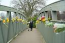 Flowers on a bridge pay tribute after the body of missing mother Nicola Bulley was found last week