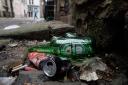 Glass bottles and drinks cans lying discarded in a lane in Glasgow city centre. The deposit return scheme (DRS) is due to go live in March next year.