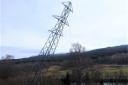 A transmission tower in Killin within the Loch Lomond and Trossachs National Park being brought down