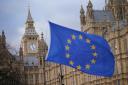 A European Union flag flies in front of the Houses of Parliament in Westminster, London, following the announcement that European Commission president Ursula von der Leyen and Prime Minister Rishi Sunak have struck a deal over the Northern Ireland