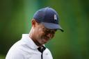 Tiger Woods grimaces on the fourth tee during the first round of the 87th Masters (Matt Slocum/AP)