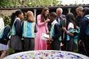 Kate Middleton fends off prying schoolchildren who just don't buy her claims she really does work for a living