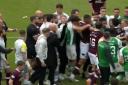 The Hearts and Hibs players and staff square off at the end of Saturday's Edinburgh derby.