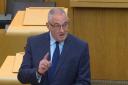 Housing Minister Paul McLennan took aim at Labour and LibDem MSPs