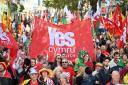 Protestors walk through Cardiff during a march in support of Welsh Independence in 2022