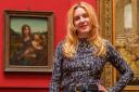 Olivia Graham stands in front of the Da Vinci artwork