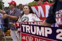 Supporters of Former President Donald Trump gather at the E. Barrett Prettyman U.S. Federal Courthouse, Thursday, Aug. 3, 2023, in Washington.