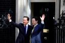 LONDON, ENGLAND - MAY 12:  British Prime Minister David Cameron welcomes Deputy Prime Minister Nick Clegg (R) to Downing Street for their first day of coalition government on May 12, 2010 in London, England. After a tightly contested election campaign