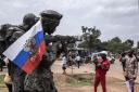 A Russian flag hangs on the monument of the Russian instructors in Bangui, during a march in 2022 in support of Russia and China's presence in the Central African Republic