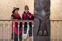 Earl Stephens (who has the Nisga'a cultural name Chief Ni'is Joohl) with Pamela Brown as they join delegates from the Nisga'a nation beside the 11-metre tall memorial pole during a visit to the National Museum of Scotland
