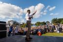 Humza Yousaf waves to the crowd at the Believe in Scotland and Yes for EU rally
