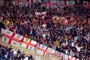 England fans celebrate in the stands after the 150th Anniversary Heritage international friendly match at Hampden Park