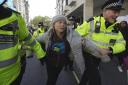 Greta Thunberg was led away by police at a climate protest in London on Tuesday