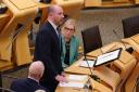 Wellbeing Economy Secretary Neil Gray speaking in the Holyrood chamber