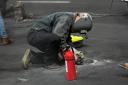 Work is performed on a manhole cover in Las Vegas (Nick Didlick/AP)