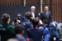 Members of the media photograph Foreign Secretary Lord David Cameron (right) and Minister for Development in the Foreign Office Andrew Mitchell arriving in Downing Street