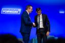 Douglas Ross and Rishi Sunak shake hands at the Scottish Conservatives party conference