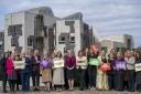 SNP women politicians gathered outside Holyrood to celebrate International Women's Day